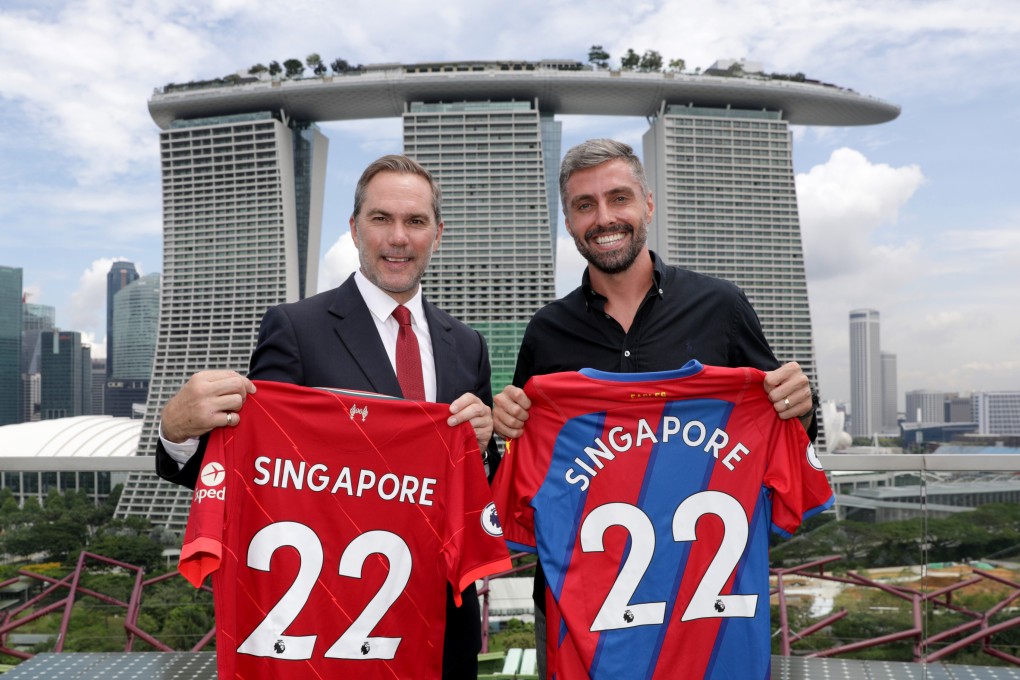 Liverpool and Crystal Palace legends Jason McAteer (left) and Andre Moritz pose in front of the Marina Bay Sands to promote their upcoming Standard Chartered Singapore Trophy clash. Photo: Paul Miller