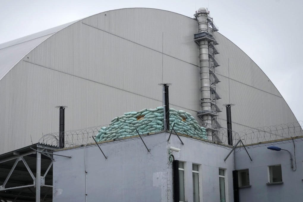 A Russian firing near a shelter adjacent to the containment structure covering the damaged reactor at the Chernobyl nuclear power plant. Photo: AP