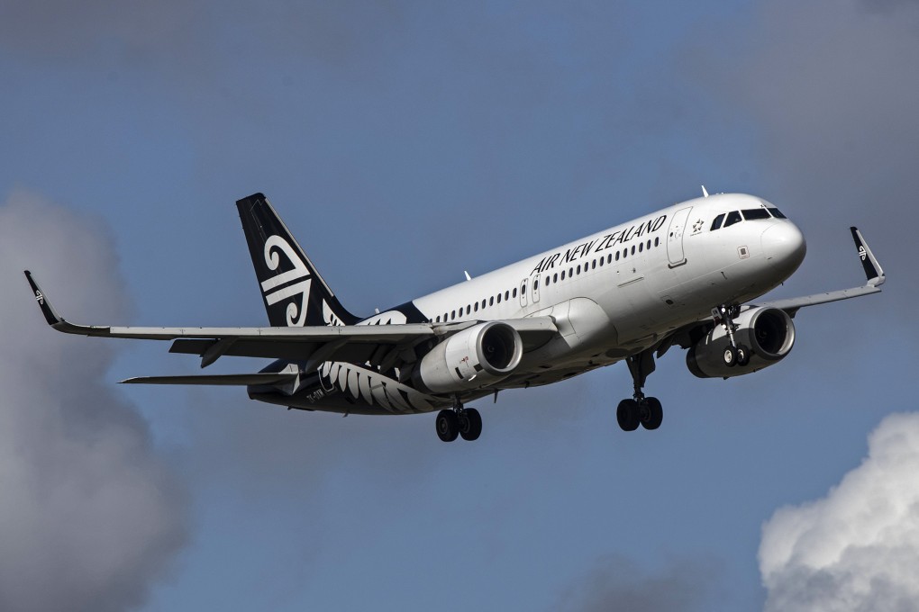 An Air New Zealand plane flies over Auckland Airport in 2020. Photo: Bloomberg