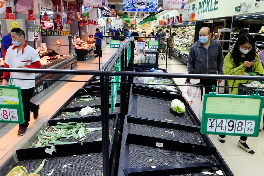 Near-empty shelves in a Beijing supermarket. Photo: Reuters