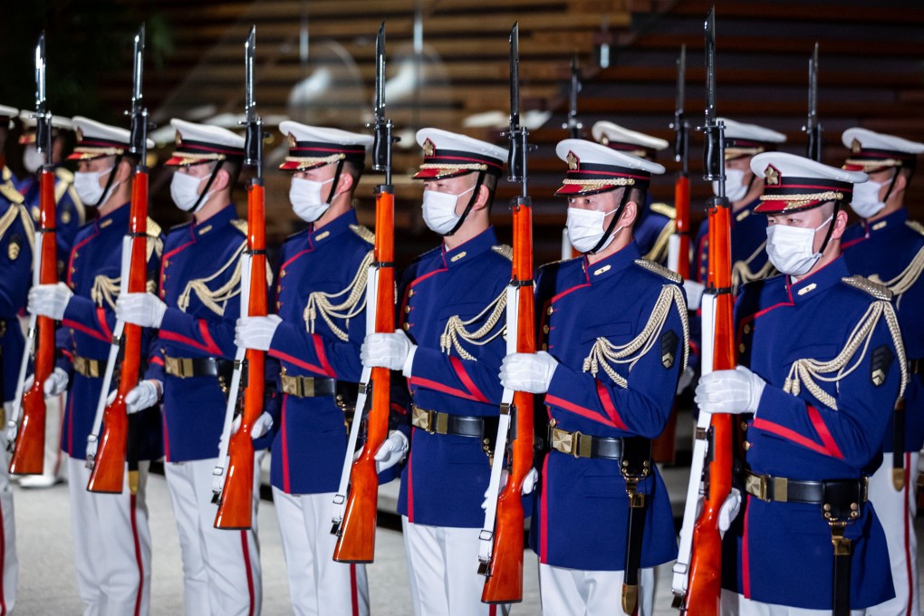 Japan’s Self-Defence Force’s honour guard members stand outside the Prime Minister’s Office in Tokyo. Photo: Reuters