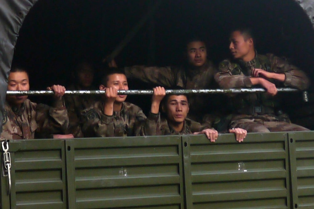 People’s Liberation Army soldiers in a truck in Garden Road, Central, Hong Kong, February 20, 2014, photographed by David Clarke for the Hong Kong in Transition archive. Photo: David Clarke