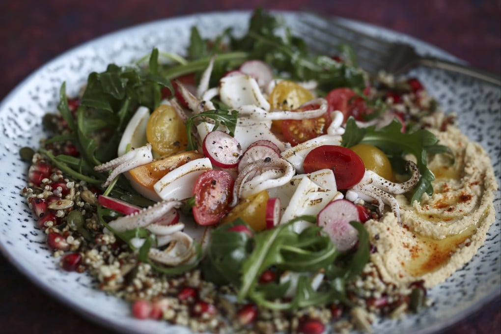 Quinoa salad with seared squid, arugula and hummus. Photo: Jonathan Wong