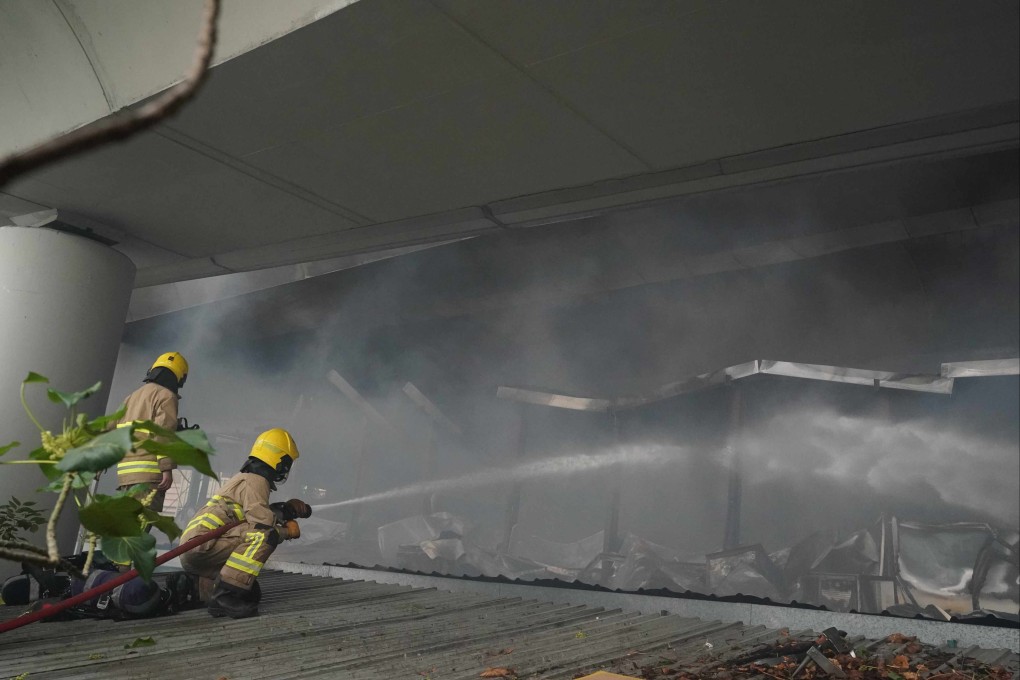 More than 250 firefighters were deployed to tackle the third-alarm fire under a Tsuen Wan Road flyover. Photo: Felix Wong