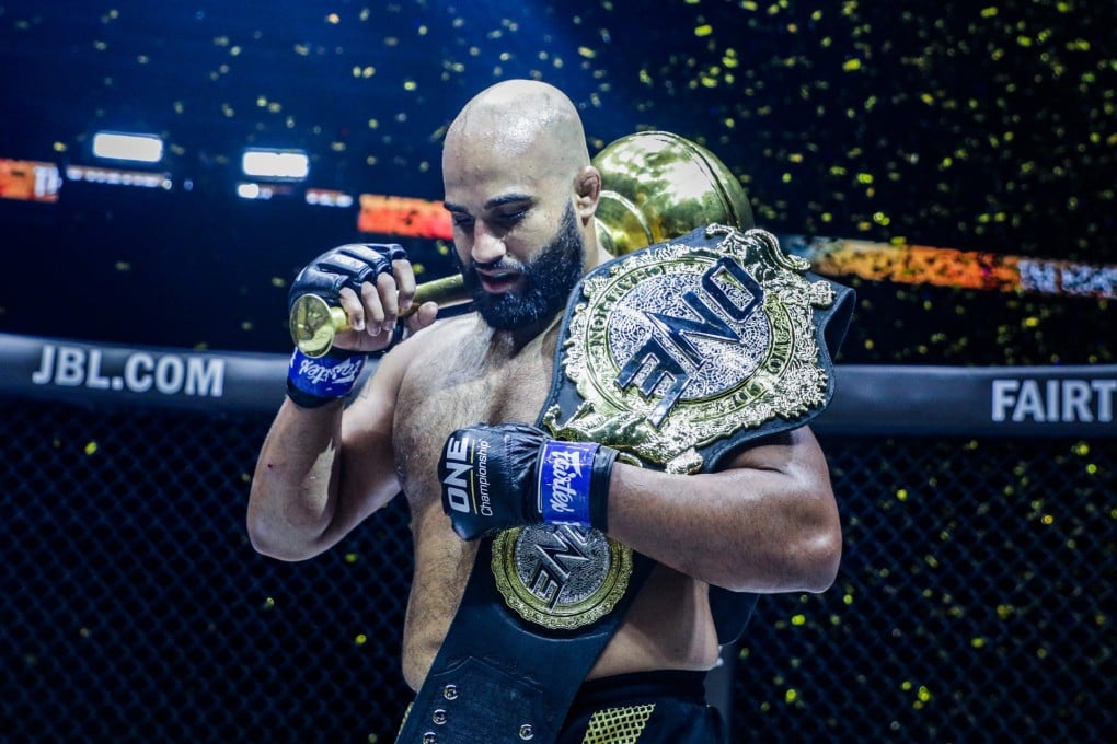 Arjan Bhullar celebrates with the ONE heavyweight world title.