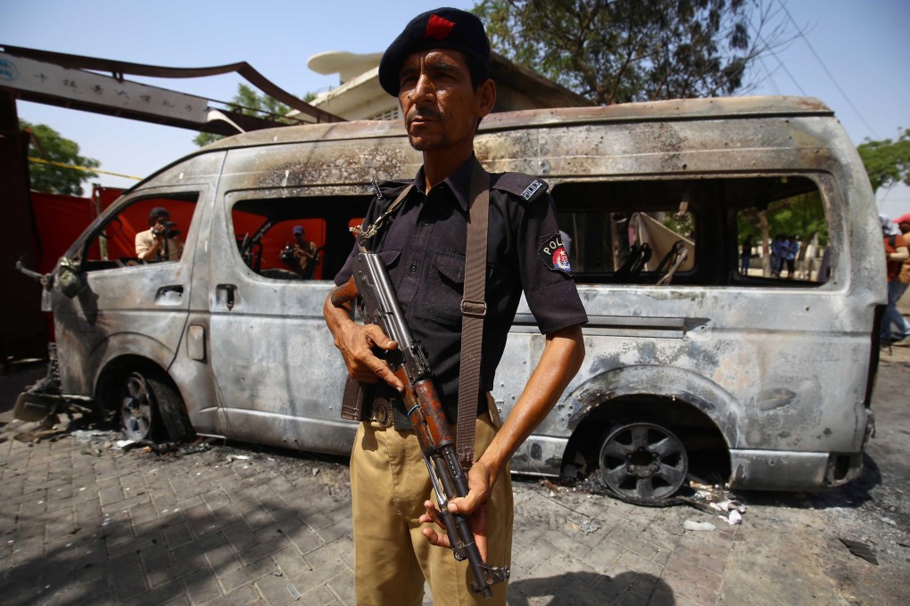 Pakistani security officials at the site of a suicide attack in Karachi. Photo: EPA-EFE