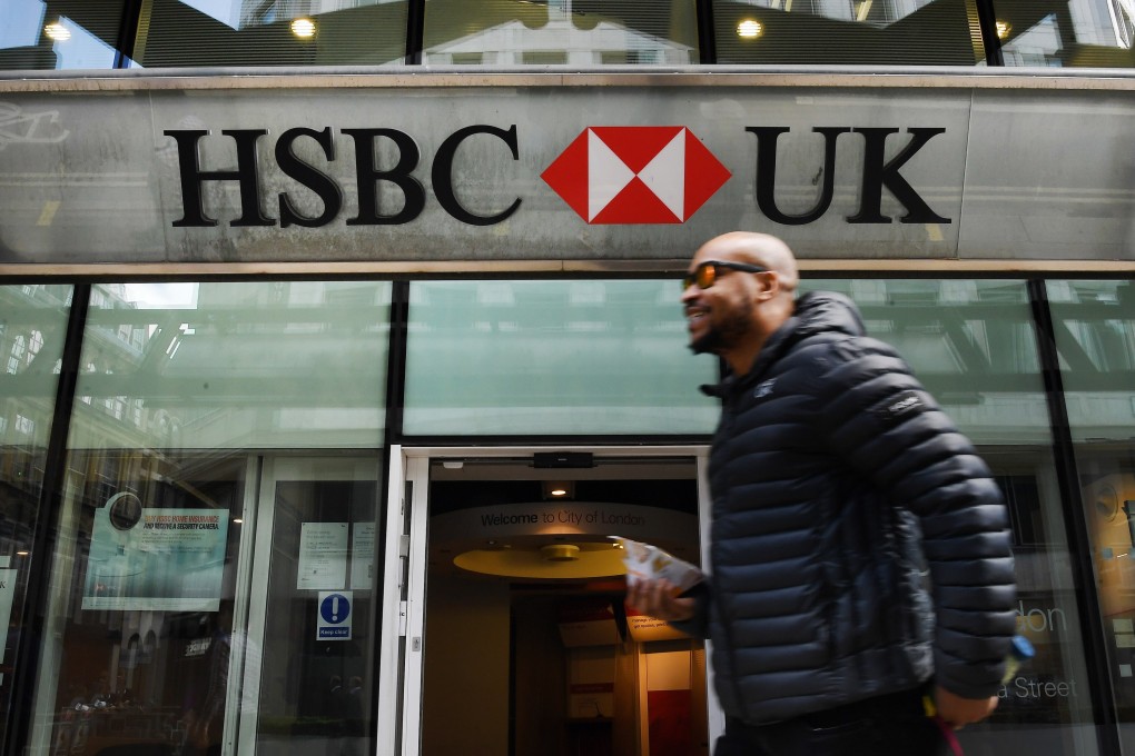 A pedestrian walks past an HSBC branch in London on Tuesday. Photo: EPA-EFE