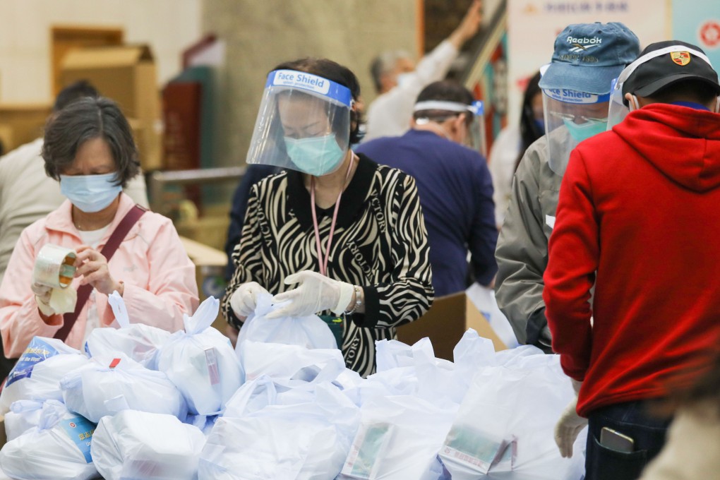 Volunteers pack anti-epidemic materials for distribution at Hong Kong Heritage Museum in Sha Tin. Photo: Yik Yeung-man