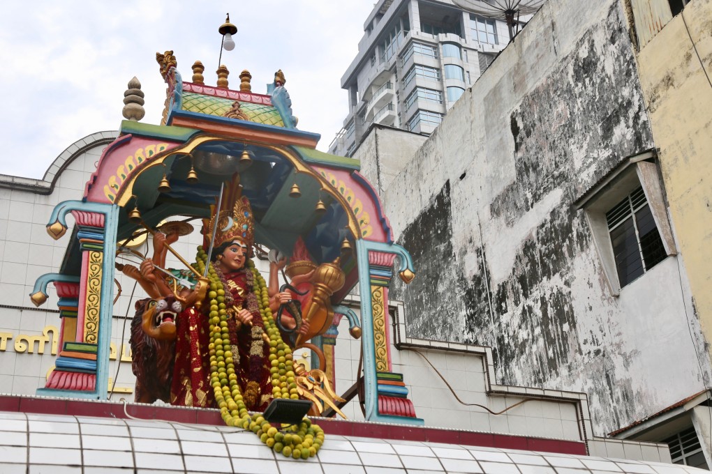 The small statue of the Hindu goddess Kali atop this temple in Medan, Indonesia, is the only thing that distinguishes it from its surroundings. But look hard enough in the city’s Little India and its cultural roots emerge. Photo: Ian Lloyd Neubauer
