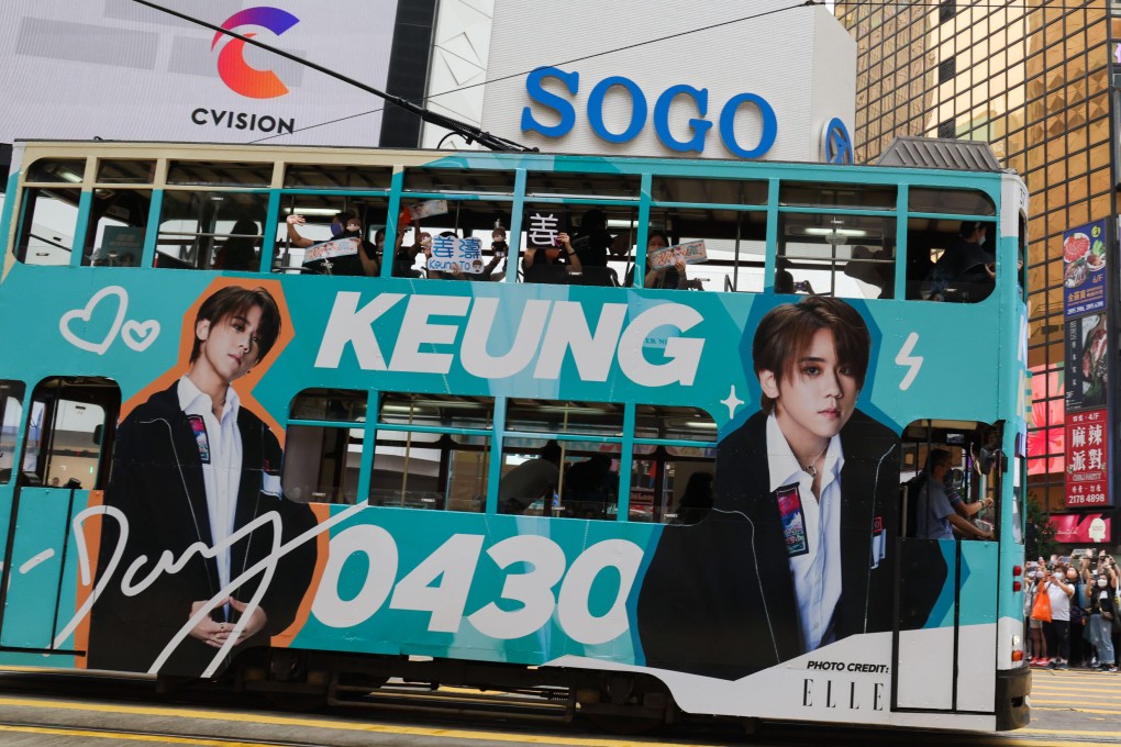 A tram in Causeway Bay with Keung To’s photos splashed over its exterior. Photo: Jelly Tse