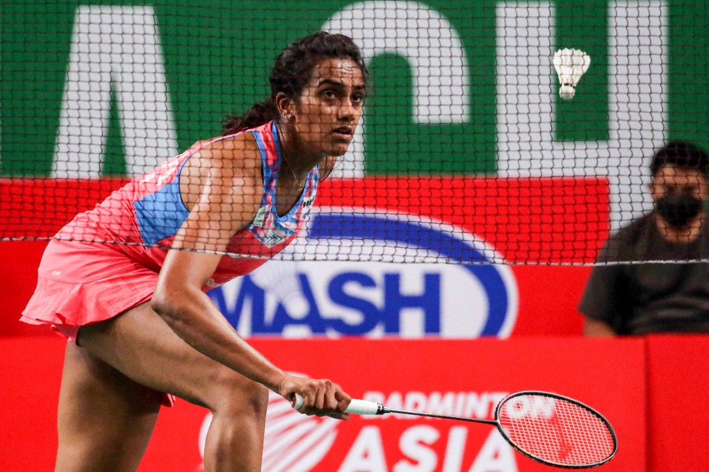 India’s P.V. Sindhu hits a return against Japan’s Akane Yamaguchi during their women’s singles semi-final. Photo: AFP