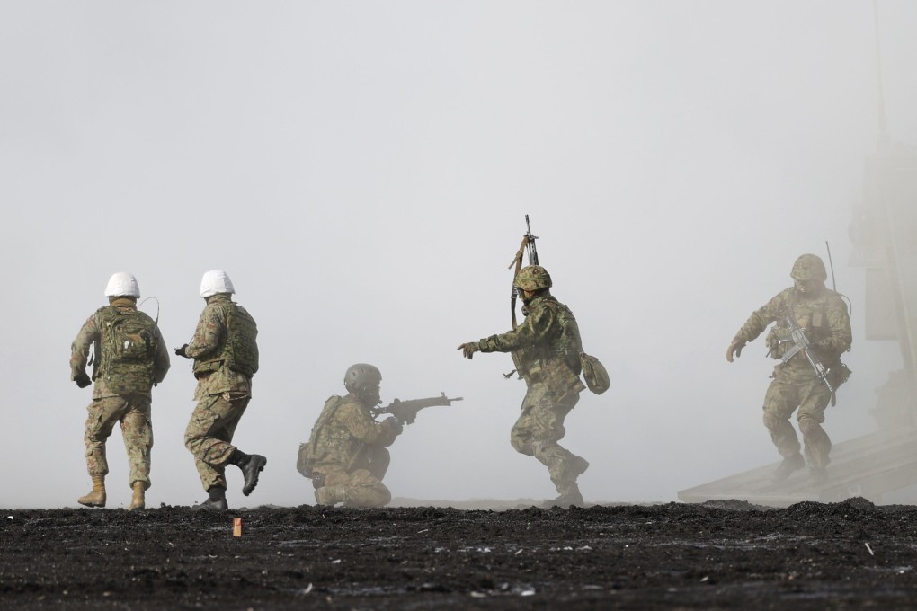 Personnel of the Japan Ground Self-Defense Force amphibious rapid deployment unit take part in a joint amphibious exercise with the US Marine Corps in March. Photo: Kyodo