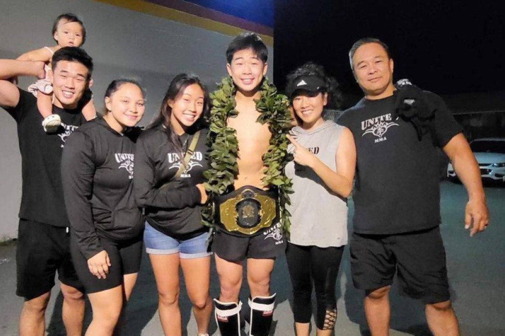 Adrian Lee celebrates winning a junior kick-boxing title alongside his family, including former ONE lightweight champion Christian Lee (left) and rising atomweight contender Victoria Lee (third left). Photo: Adrian Lee/Instagram