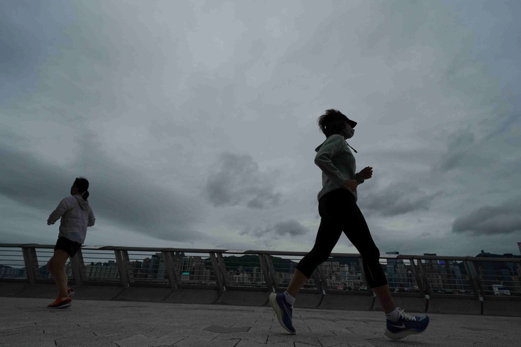 Joggers on the Tsim Sha Tsui waterfront. Photo: Felix Wong