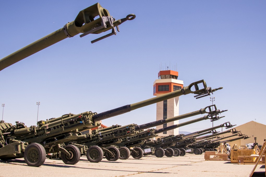 US Marine Corps M777 towed 155 mm howitzers are staged on the flight line before being loaded onto a US Air Force C-17 Globemaster III aircraft bound for Europe for delivery to Ukrainian forces, at March Air Reserve Base, California, in April. Photo: US Marine Corps via Reuters