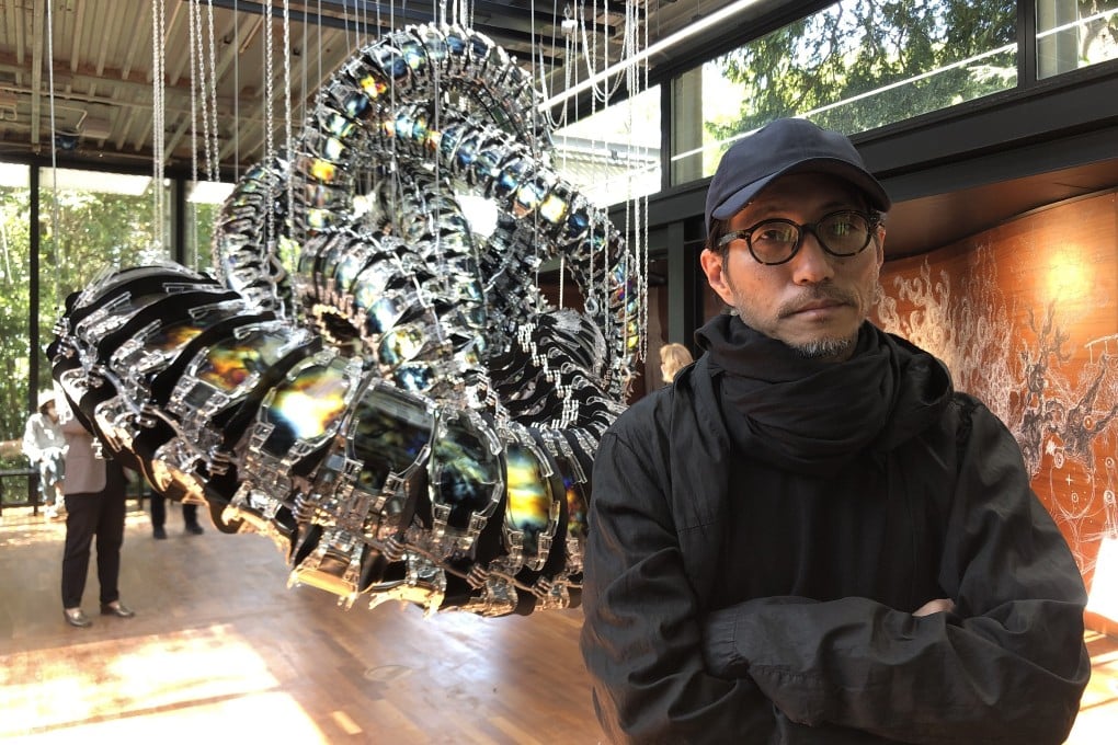 Artist Kim Yun-chul in front of his “Chroma V”, suspended in the middle of the South Korean pavilion at the Venice Biennale 2022. Photo: Enid Tsui