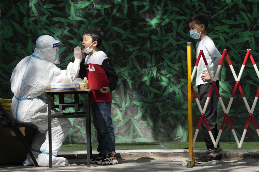 A child is swabbed during mass Covid-19 testing in Beijing on Tuesday, May 3. Photo: AP Photo