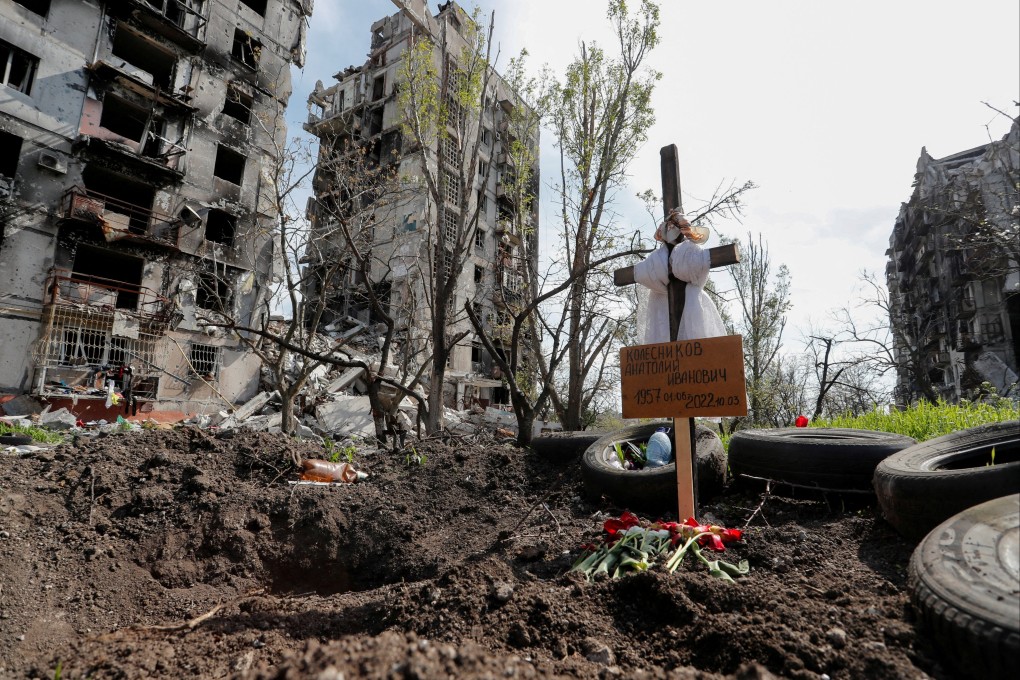 Graves of a civilian killed during Ukraine-Russia conflict in the southern port city of Mariupol, Ukraine on Tuesday. A grave board reads: “Kolesnikov Anatoly Ivanovich”. Photo: Reuters