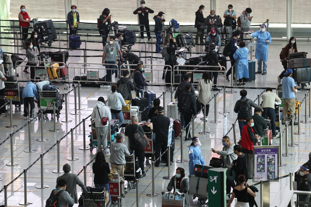 Passengers arriving at Hong Kong International Airport queue to take Covid-19 tests before heading to their quarantine hotels on May 3. More flights are expected to arrive after the government eased some travel restrictions. Photo: K.Y. Cheng