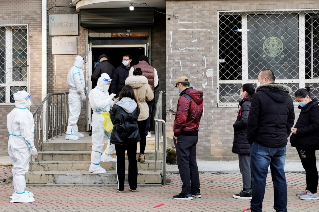 Local residents line up to be tested for the coronavirus in Dalian, Liaoning province, where local authorities say large-scale testing will be conducted weekly, from Thursday. Photo: Getty Images