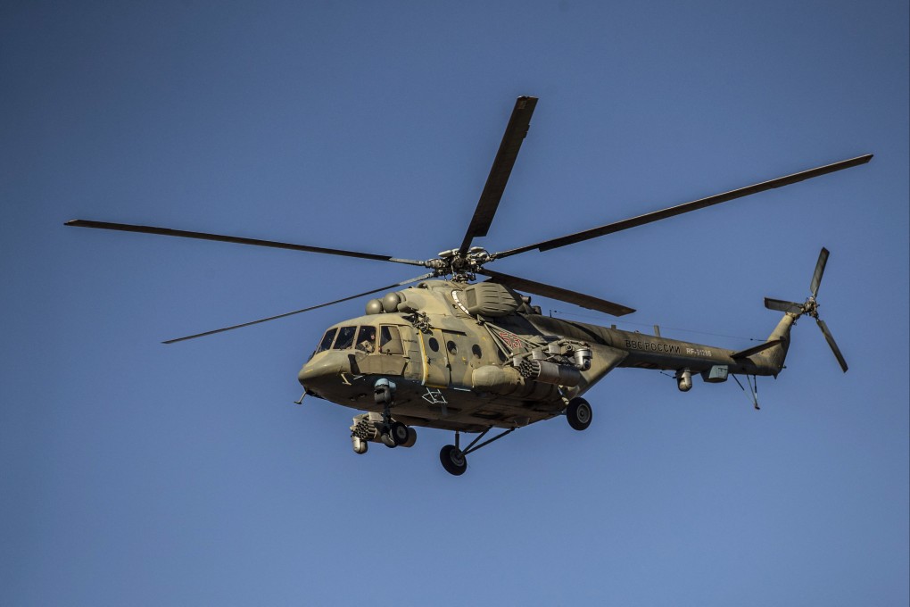 A Russian Mi-17 helicopter supports a joint Russian-Turkish patrol near the Syrian town of al-Jawadiyah in December 2020. Photo: AFP