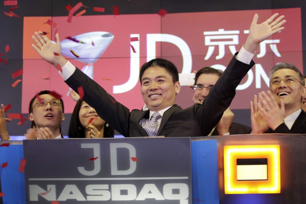 Richard Liu Qiangdong raises his arms to celebrate the IPO of his company JD.com at the Nasdaq MarketSite in New York on May 22, 2014. JD.com recently said it had approved its first dividend since going public. Photo: AP