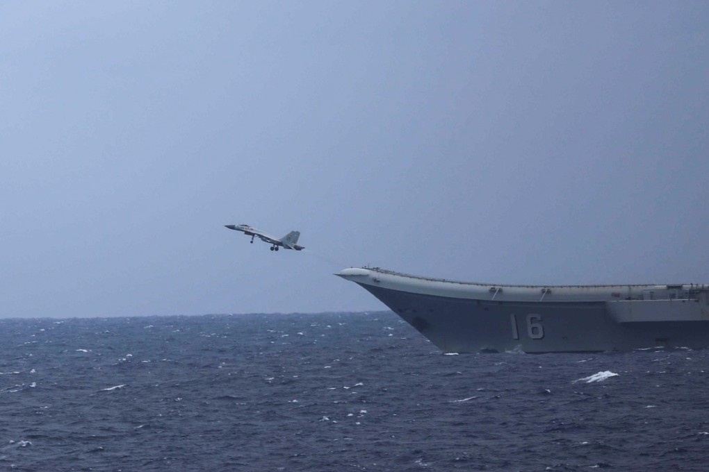 A Chinese carrier-based J-15 fighter takes off from the Liaoning on Tuesday. Photo: Japan Ministry of Defence