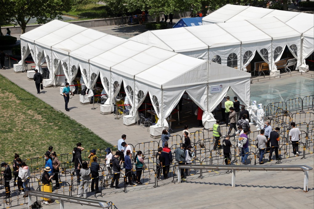 People line up for mass Covid-19 testing in Haidian district, Beijing. Photo: Reuters
