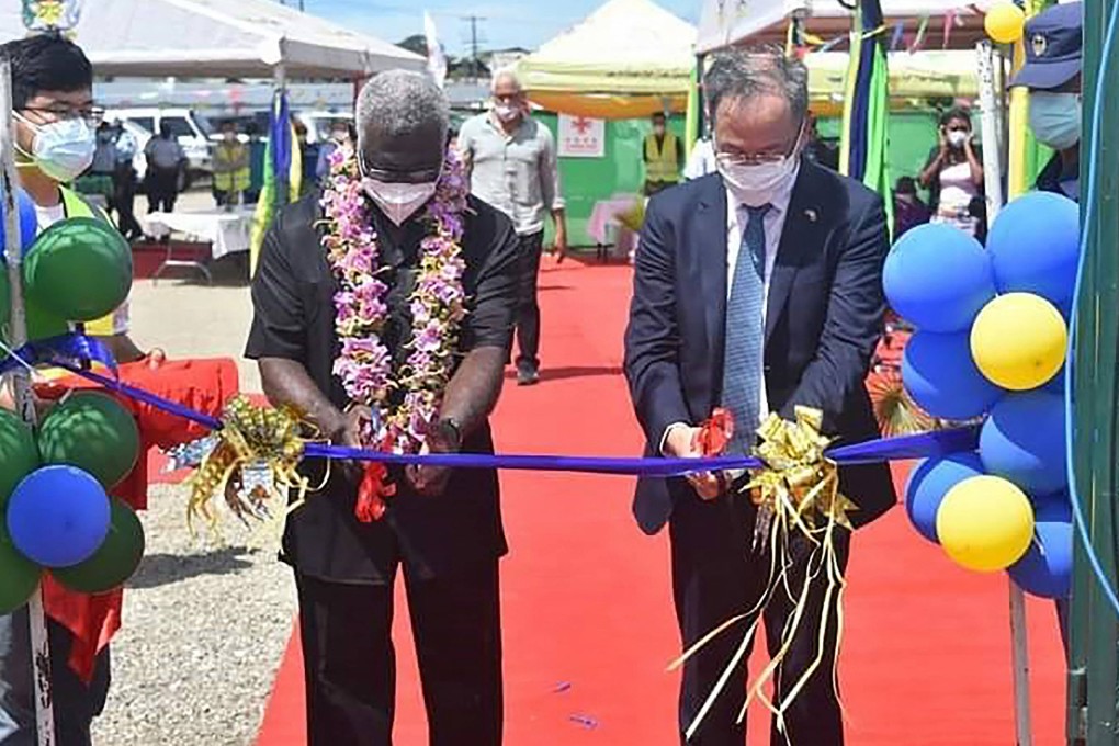 China’s envoy to the Solomons Li Ming (right) and the Pacific nation’s Prime Minister Manasseh Sogavare cut a ribbon during the opening ceremony of a Beijing-funded stadium complex in Honiara last month. Photo: AFP