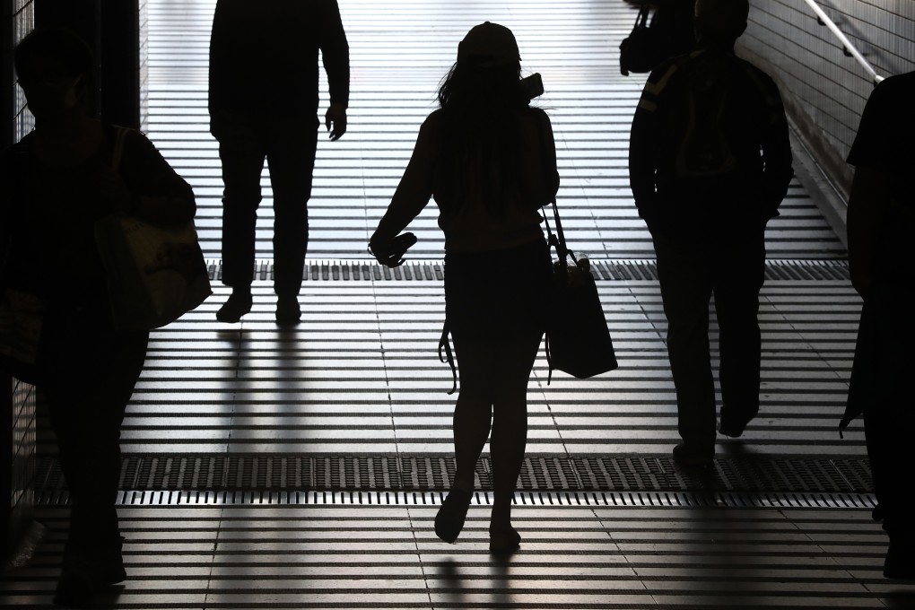 Commuters in Hong Kong’s Tai Wai MTR Station. Interest rate increases mean more pain for residents already dealing with the effects of pandemic restrictions and the lingering impact of anti-government protests. Photo: Jonathan Wong