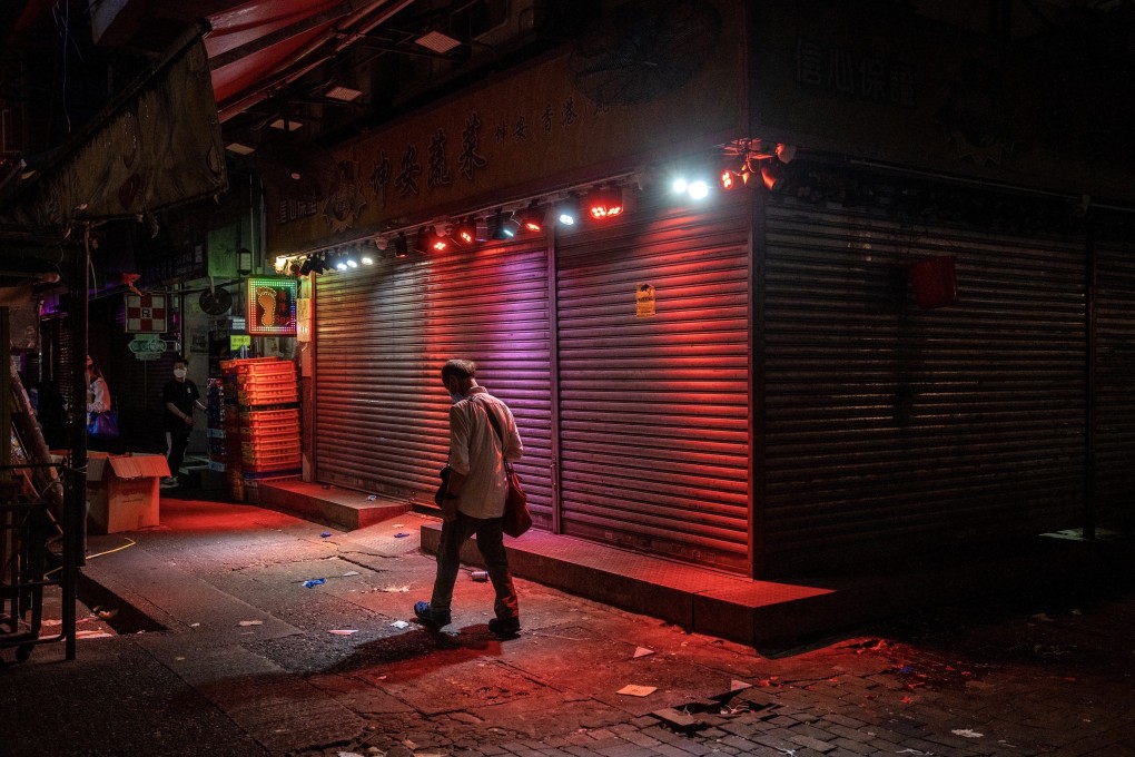 A man walks past a closed shop in Hong Kong on April 30. Falling growth figures could be a harbinger of continuing weakness. Photo: Bloomberg
