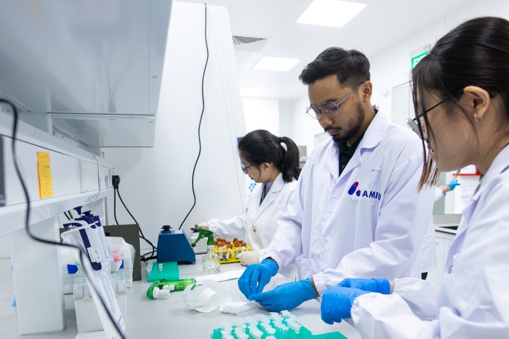 Researchers work at Amili’s lab in Singapore. Photo: Handout