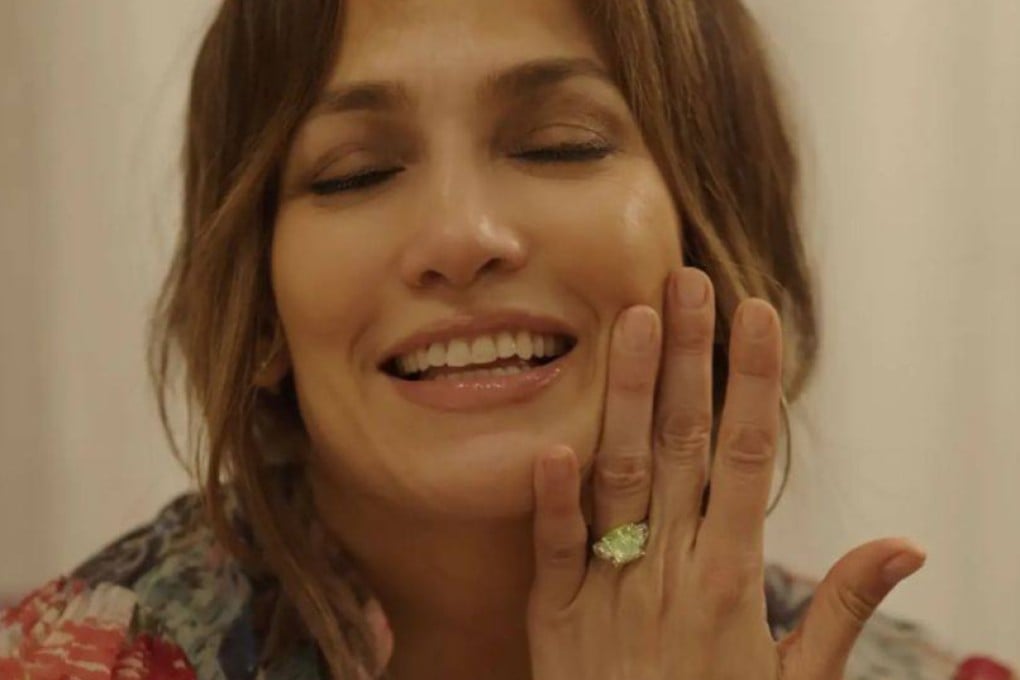 Jennifer Lopez wearing her green diamond engagement ring from Ben Affleck in April 2022. Her ring seems to be putting the spotlight on rare coloured diamonds.
