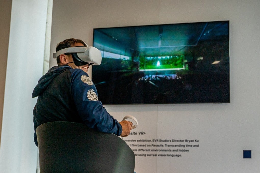 A visitor at the “Korea: Cubically Imagined” travelling exhibit, which is currently in New York, uses VR tech to “enter” the sets of the Oscar-winning movie Parasite. Photo: Korea: Cubically Imagined presented by KOCCA