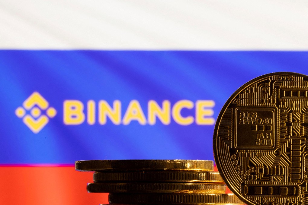 A representation of cryptocurrency is seen in front of the Binance logo and Russian flag in this illustration taken, March 4, 2022.  Photo: Reuters