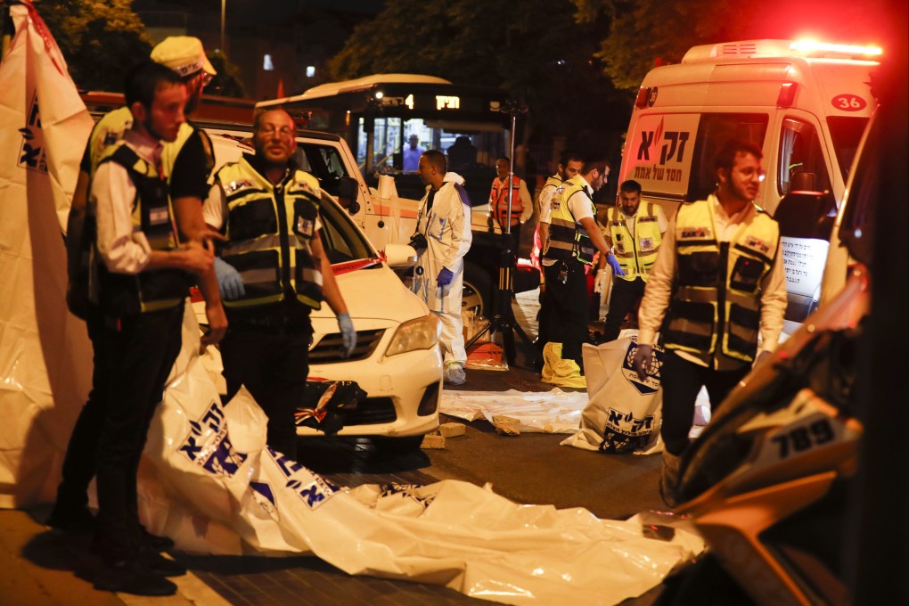 Israeli medical personnel arrive at the scene of of an attack in Elad, near Tel Aviv, on Thursday. Photo: EPA-EFE