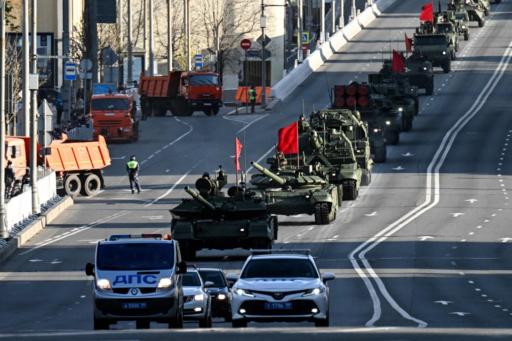 A Russian T-90M tank (front) and other military vehicles drive towards Red Square for a rehearsal of the Victory Day military parade in Moscow on Wednesday. Photo: AFP