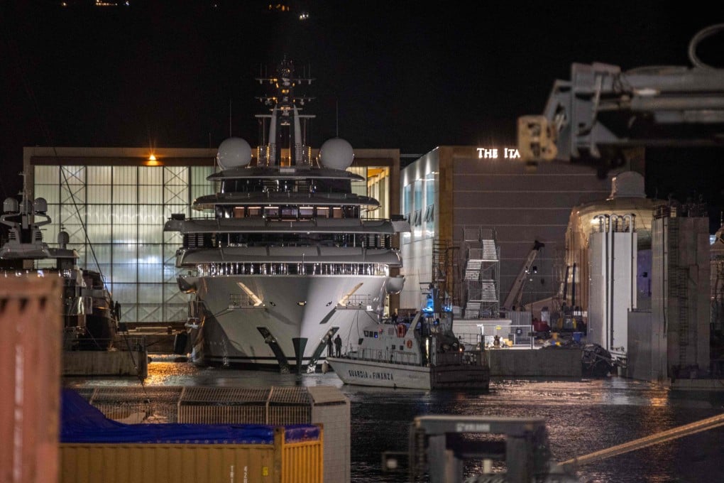 An Italian police boat is seen in front of the Scheherazade superyacht, docked at the port of Marina di Carrara on Friday. Photo: AFP