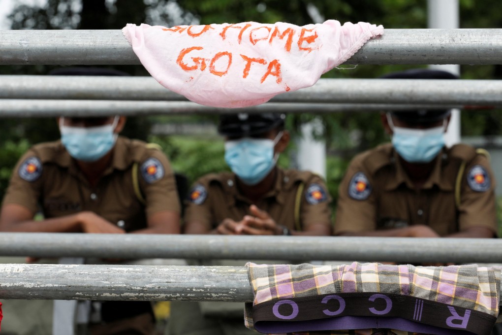 Sri Lankan protesters hung underwear with the message “Go home Gota” on a meal barrier outside parliament during a rally demanding the resignation of President Gotabaya Rajapaksa and his cabinet in Colombo on Friday. Photo: Reuters