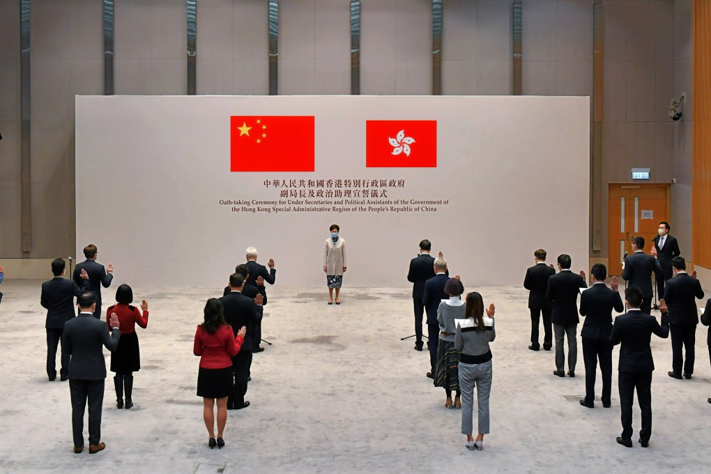 High-ranking civil servants take an oath of allegiance to Hong Kong’s Basic Law and the country, witnessed by city leader Carrie Lam in 2020. Photo: Handout