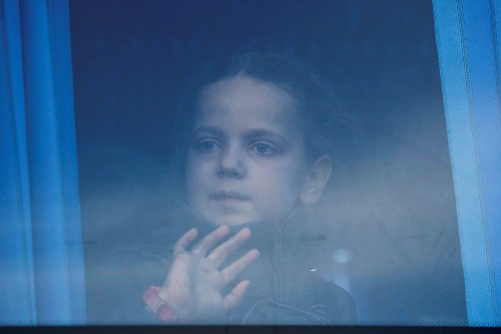 A girl looks through the bus window as civilians evacuated from Azovstal steel plant in Mariupol arrive at a temporary accommodation centre in the village of Bezimenne, Ukraine on May 6. Photo: Reuters