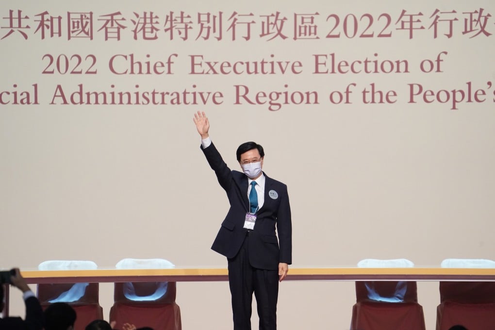 Chief Executive-elect John Lee waves from the stage of the Hong Kong Convention and Exhibition Centre in Wan Chai on Sunday. Photo: Sam Tsang