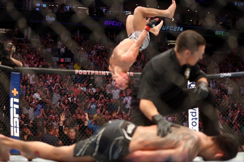 Spectators react as Michael Chandler does a backflip in celebration of his knockout victory against Tony Ferguson at UFC 274. Photo: USA TODAY Sports