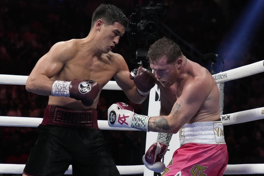 Dmitry Bivol connects with a left to the jaw of Canelo Alvarez during their light heavyweight title fight in Las Vegas. Photo: AP