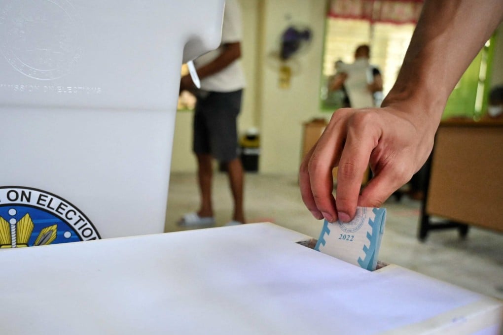 A man casts his vote on Monday at a polling station in Manila for the Philippines’ presidential election. Photo: AFP