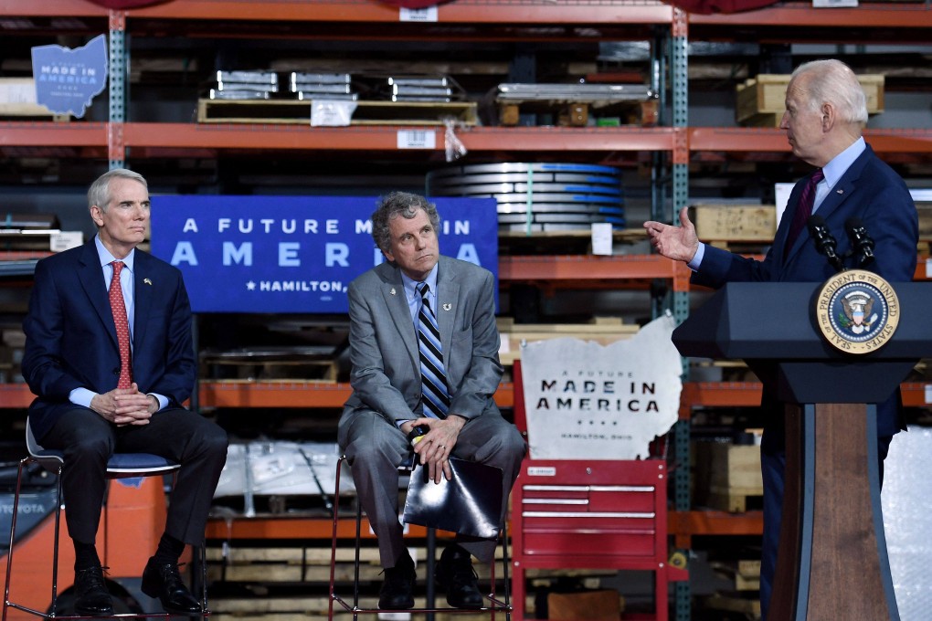 US Senators Sherrod Brown (left) and Rob Portman (centre) of Ohio listen to US President Joe Biden speak at United Performance Metals in Hamilton, Ohio, on May 6. Photo: AFP