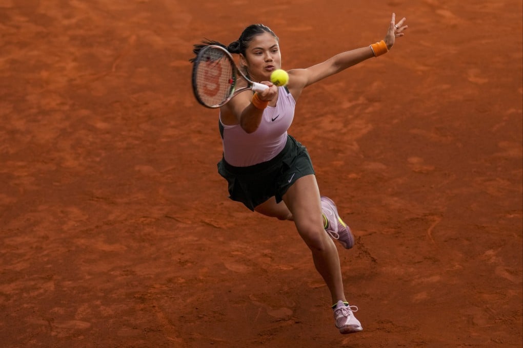 Emma Raducanu returns the ball against Marta Kostyuk during their match at the Madrid Open. Photo: AP