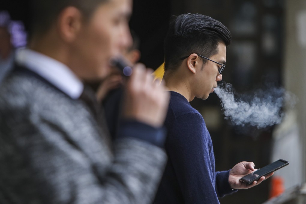 People using e-cigarettes in Admiralty, Hong Kong. Photo: Winson Wong