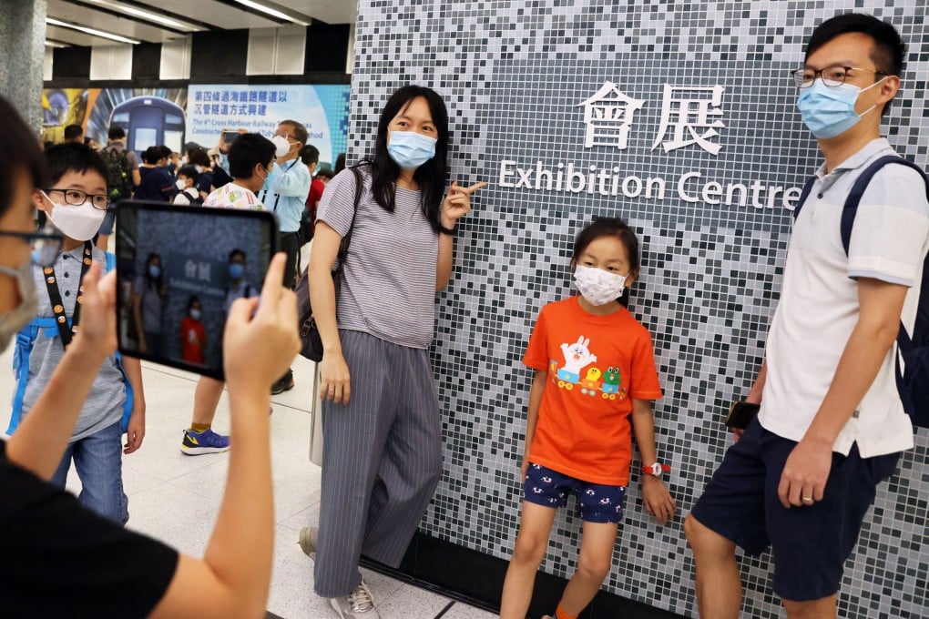 A photo-op for rail fans at the new station. Photo: Nora Tam