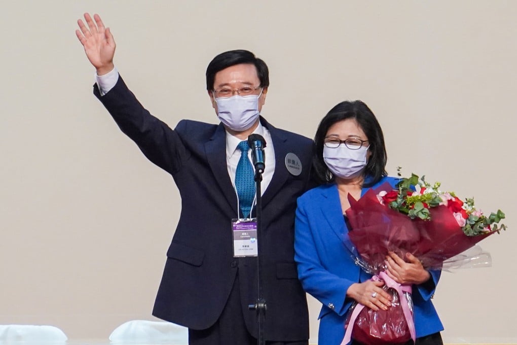 Chief Executive-elect John Lee shares the stage with his wife Janet Lam on Sunday. Photo: Sam Tsang